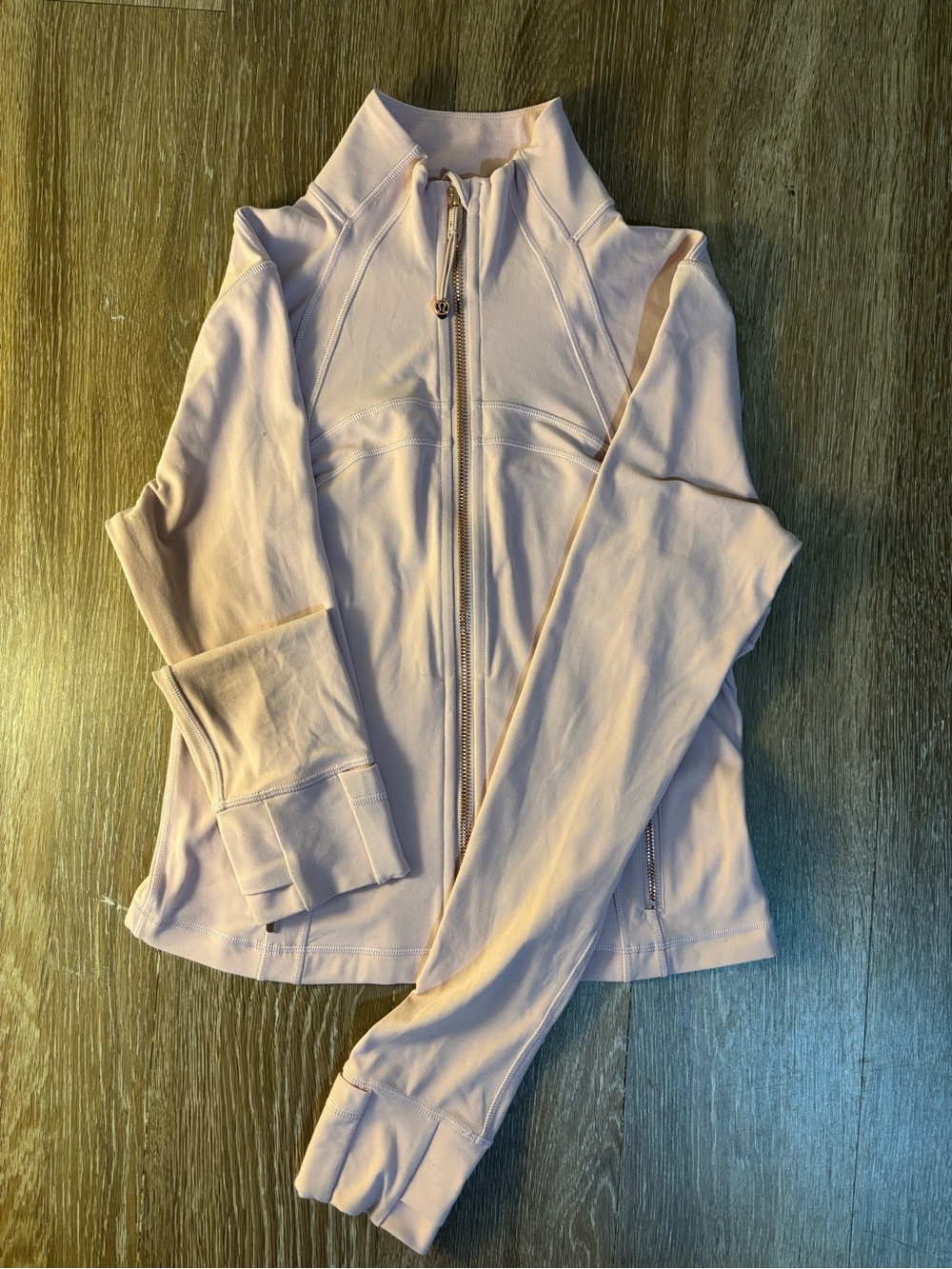 Cropped Lululemon define jacket. Light pink with rose gold zipper. never worn
